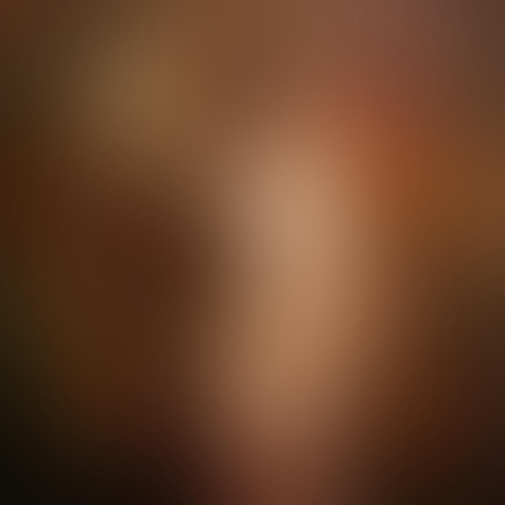 A powerful female figure standing confidently, illuminated by soft, warm lighting to highlight the beauty of the human form, surrounded by abstract representations of empowerment like flowers and light. Incorporate elements of nature to symbolize growth and self-acceptance, while maintaining an artistic and tastefully nude composition. Evoke a sense of strength and liberation in the expression. ethereal. soft focus. vibrant colors.